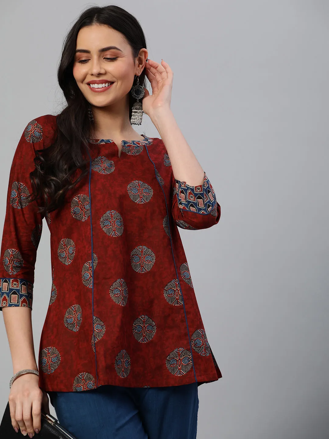 Khoobsurat - A flared tunic with slit and printed collar and sleeve cuff.